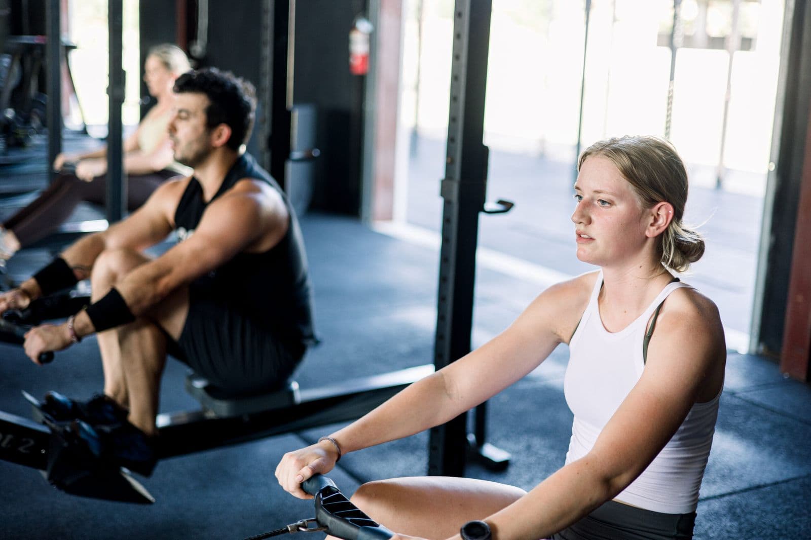 Athletes rowing at CrossFit Aggieland, training for Hyrox race preparation